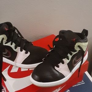 Size 2 boy/girl glow in the dark Nike sneakers